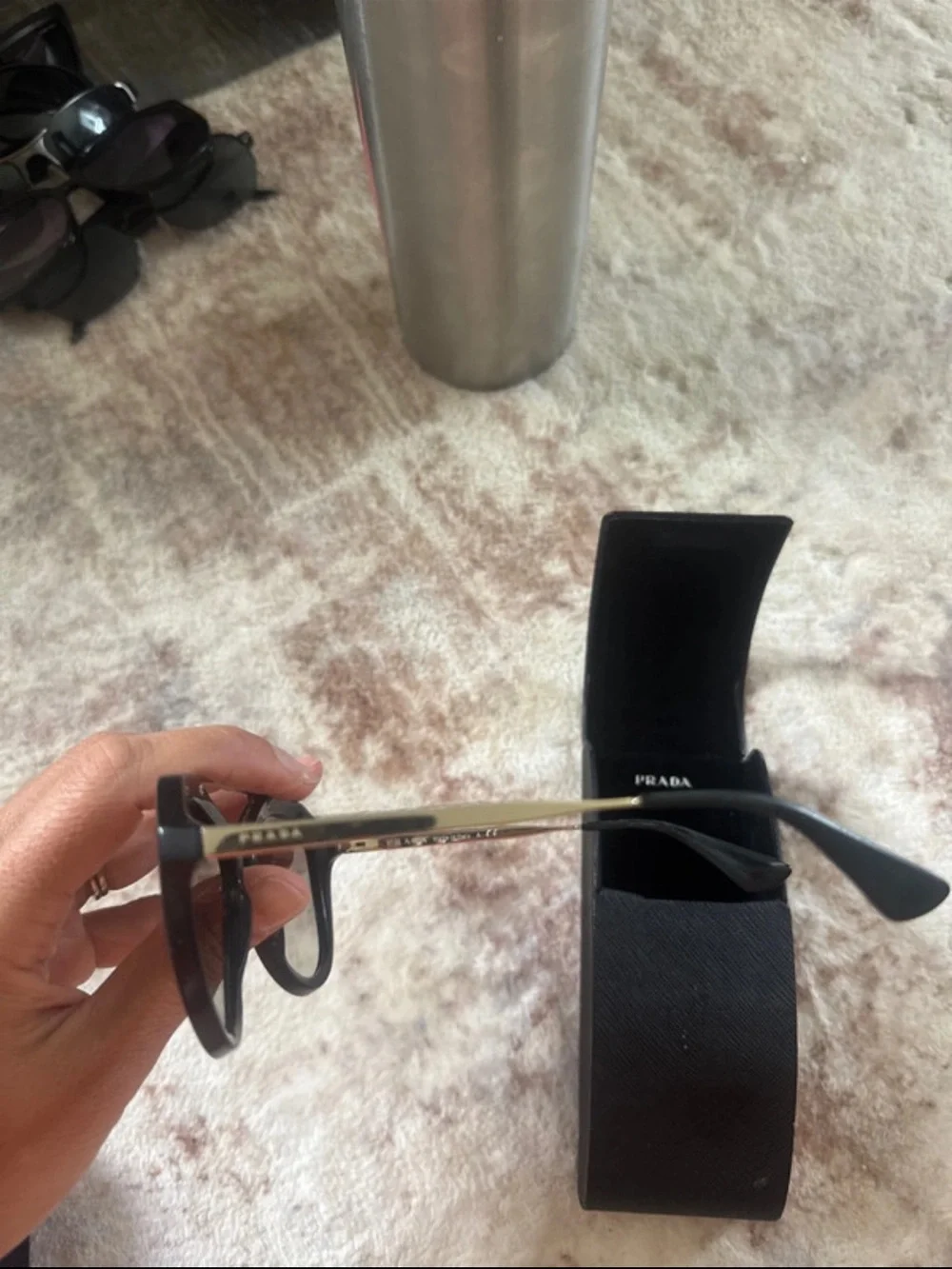 Prada Black Cat-Eye Sunglasses with Gold Bridge